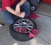 Rolling the tire off the rim sm.jpg
