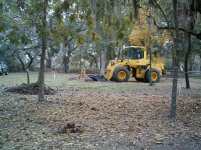 044-skid loader starting to remove stump.jpg 044-skid loader starting to remove stump.jpg