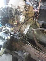 BENDIX LOW AND NEXT TO THE ENGINE AND POWER STEETING PUMP.jpg