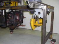 Metal work bench with fold away chop saw.jpg