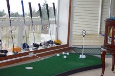Deans putting green with putters.jpg