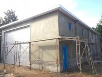 RV barn SE corner stucco 2 still working scaffold.jpg