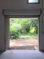 RV barn back rollup door inside 3 open to backyard.jpg