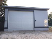RV barn front garage door outside after paint, electrical.jpg