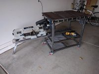 welding table with bandsaw on a movable shelf under it 2.jpg
