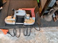 cutting unistrut to size with milwaukee bandsaw on saw horses and clamped 1 (2).jpg