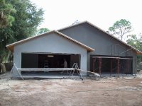 Garage now stuccoed.JPG