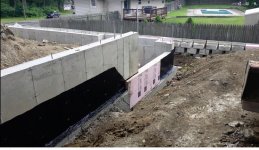 Forms removed, water proofing done and 3 inch insullation goin on the foundation.jpg
