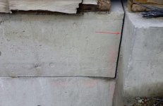 red arrow indicates where wall was cut with a diamond chain saw.jpg