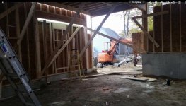 Rear garage door framed. Small bumpout on the left wall that will have cabinets and a spot below.jpg