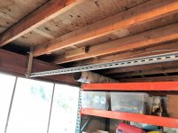 unistrut hanging from ceiling joists ready for plywood 3.jpg