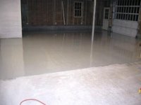 Garage epoxy floor half done 1.JPG