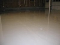 garage epoxy coat half done 2.JPG