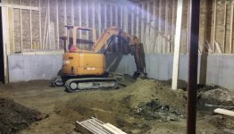 getting started on grading the inside of the garage.jpg